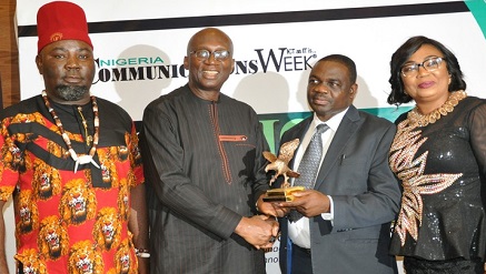 (L-r): Ken Nwogbo, publisher and CEO, CommunicationsWeek Media Limited; Dr. Ernest Ndukwu, chairman, Open Media Group and Chairman of the occasion; Adedayo Peter Arogundade, CommunicationsWeek ‘Man of The Year’ awardee and wife, during the unveiling at BOICT lecture/awards 2017 held in Lagos